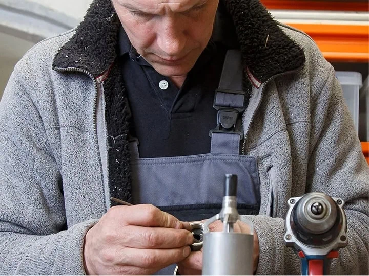 A man is working on a machine